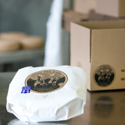 Once a batch has reached its peak, we wrap its 70 wheels and send them out to shops and restaurants across the country <a href="https://uplandscheese.com/photos/cheesemaking-process/cheeseprocess-14.jpg">Download Image</a> 4 m .jpg